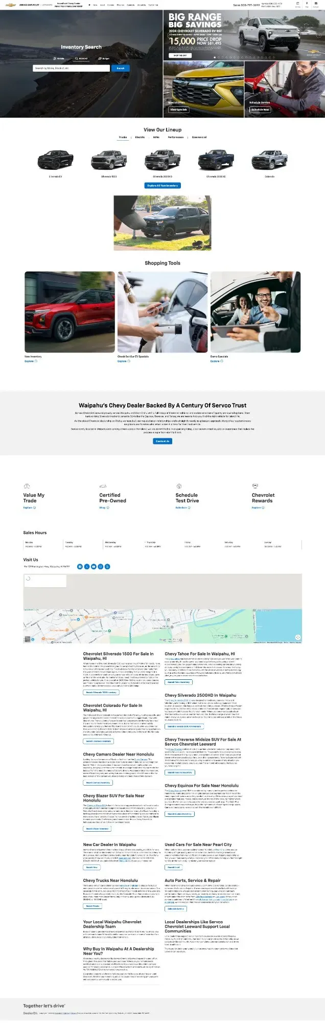 The dealer homepage before the overhaul: a Silverado on a mainland mountain road, stock photography and a national savings banner.