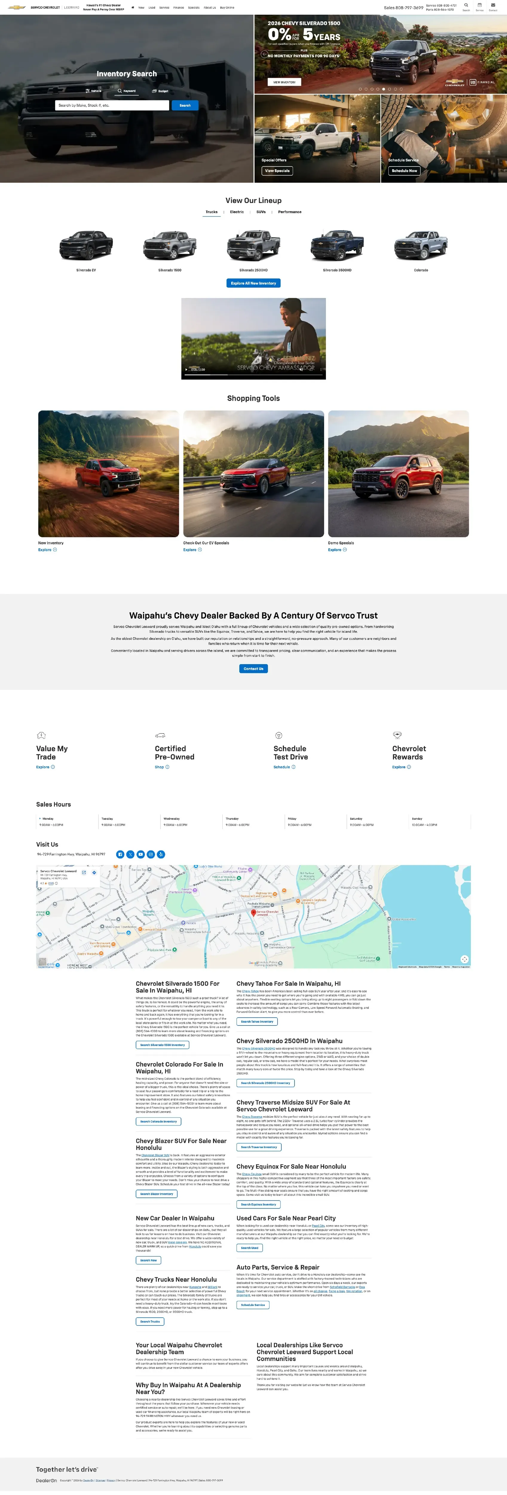 The same homepage after: a Silverado shot dark and low, a local finance offer, and shopping tiles set against the Koʻolau range.
