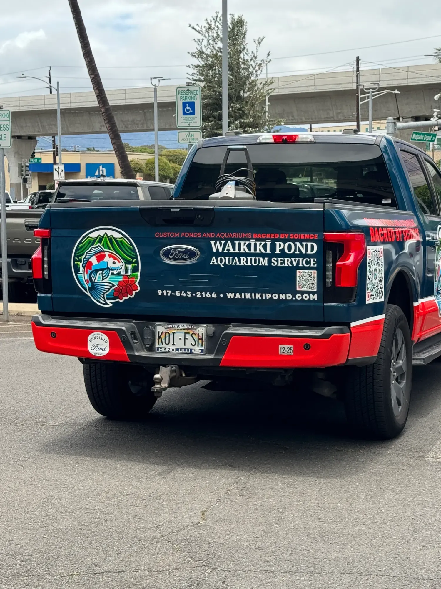 The tailgate, carrying the QR code and contact details.
